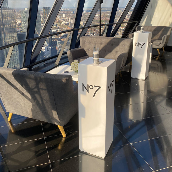 White square display plinth at a live event