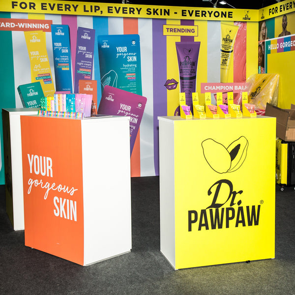 White retail display counter with open shelves